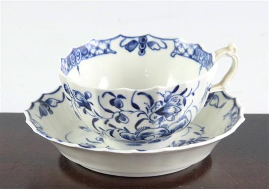 A Worcester Hollow Rock Lily pattern fluted tea cup and saucer, of rare shape, c.1770, tea cup diameter 7.7cm